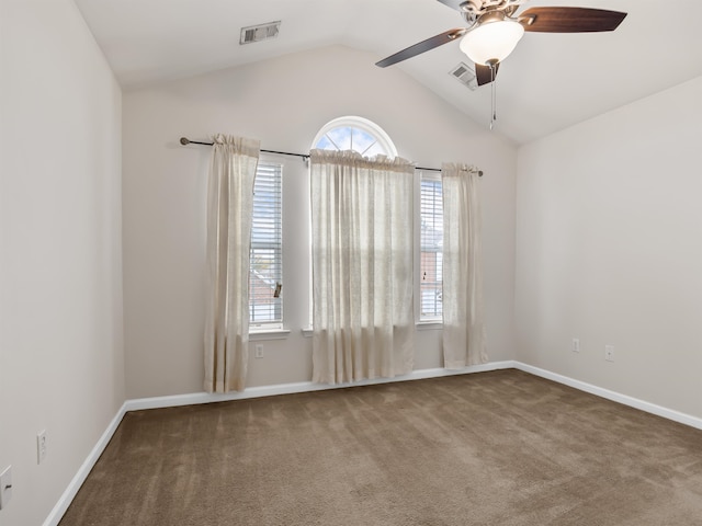 unfurnished room with ceiling fan, vaulted ceiling, and carpet