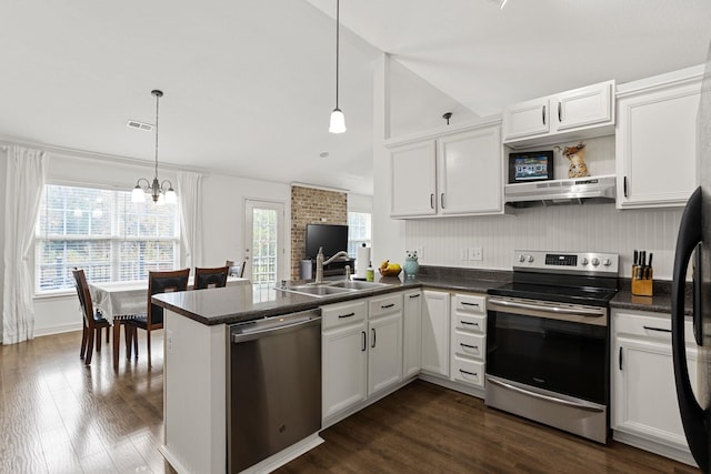 kitchen with stainless steel appliances, kitchen peninsula, ventilation hood, white cabinetry, and decorative light fixtures