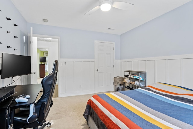 bedroom featuring light colored carpet and ceiling fan