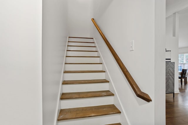 stairway featuring wood-type flooring