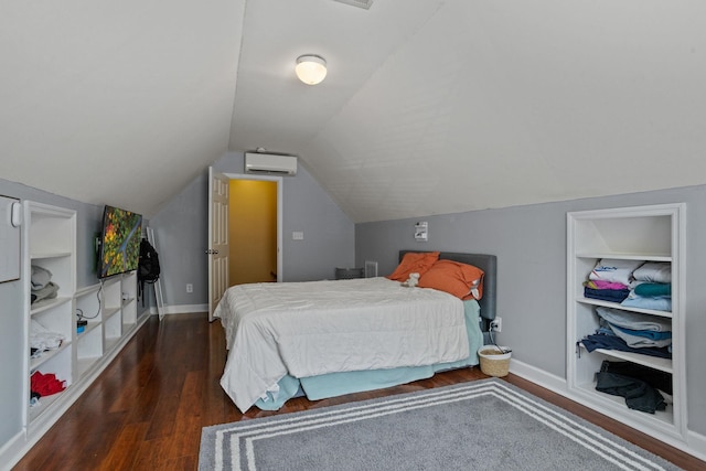 bedroom featuring a wall unit AC, lofted ceiling, and dark hardwood / wood-style floors