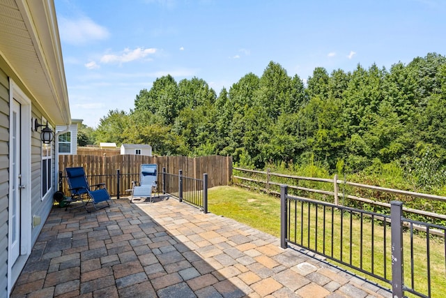 view of patio / terrace with a storage unit