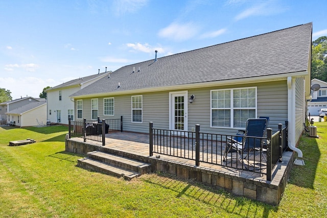 rear view of house with a lawn and a patio