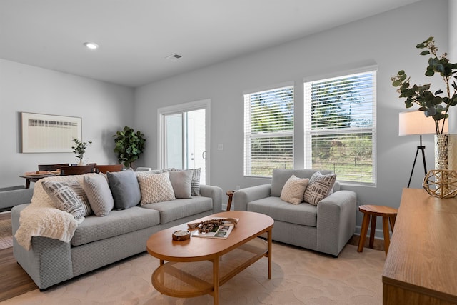 living room with light colored carpet