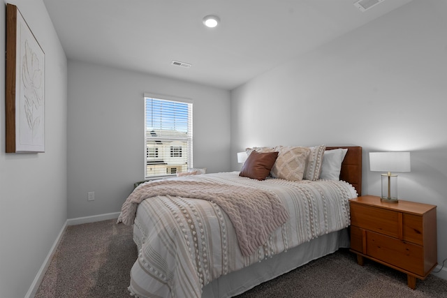 bedroom with dark carpet