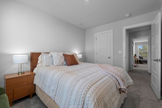 bedroom featuring dark carpet