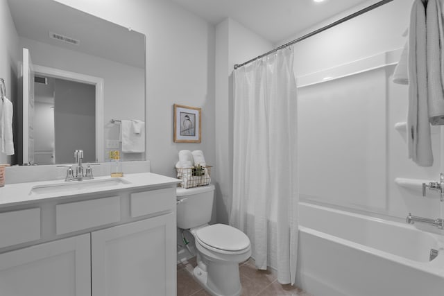 full bathroom featuring toilet, vanity, shower / bath combo with shower curtain, and tile patterned flooring