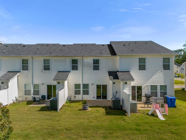 back of property featuring a patio and a yard