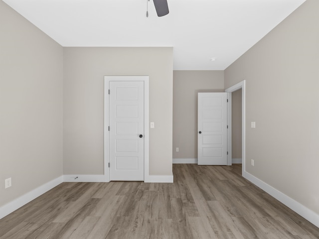 unfurnished bedroom with light hardwood / wood-style flooring and ceiling fan