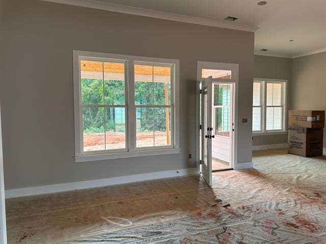 doorway featuring crown molding