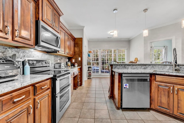 kitchen with stainless steel appliances, tasteful backsplash, sink, light stone counters, and light tile patterned floors