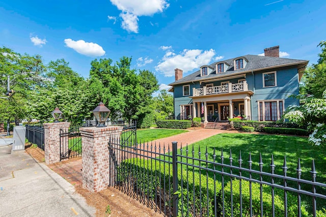 view of front of home with a porch and a front lawn