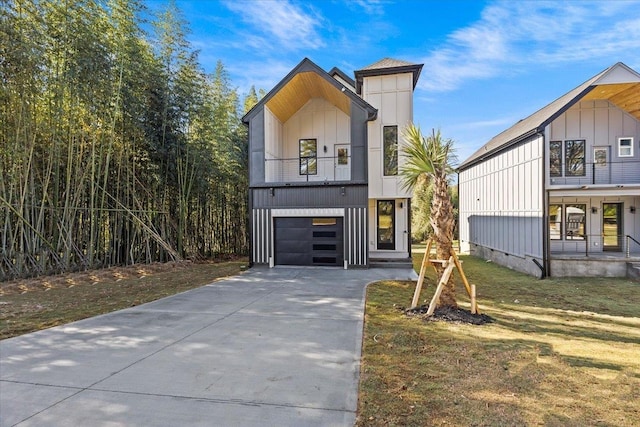 view of front of home with a garage and a front yard