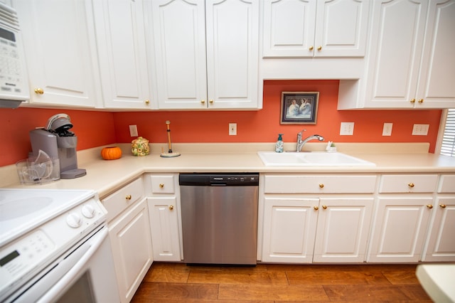 kitchen featuring white appliances, sink, and white cabinets