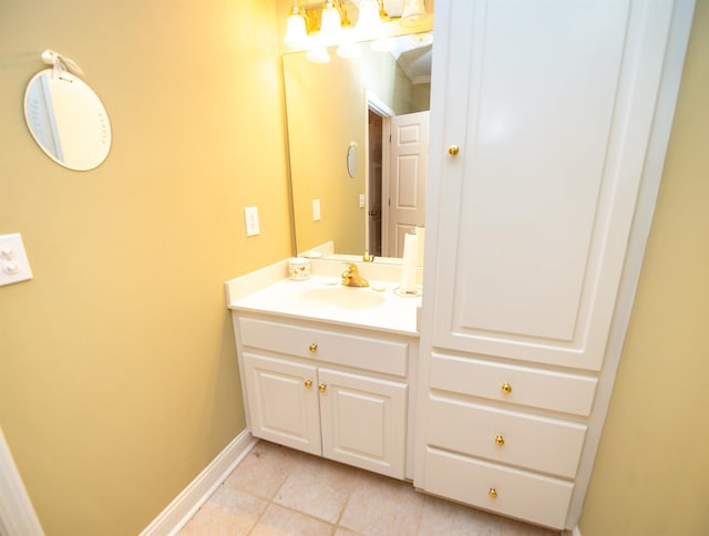 bathroom with tile patterned flooring, vanity, and crown molding