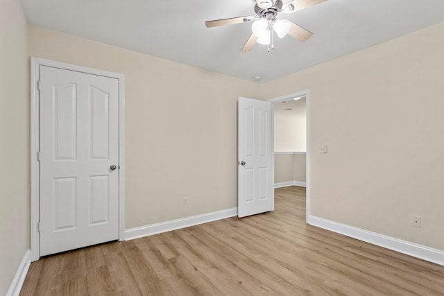 unfurnished bedroom featuring ceiling fan and light hardwood / wood-style flooring