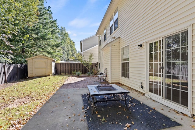 view of patio featuring a storage unit