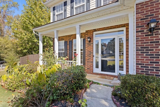 doorway to property with a porch