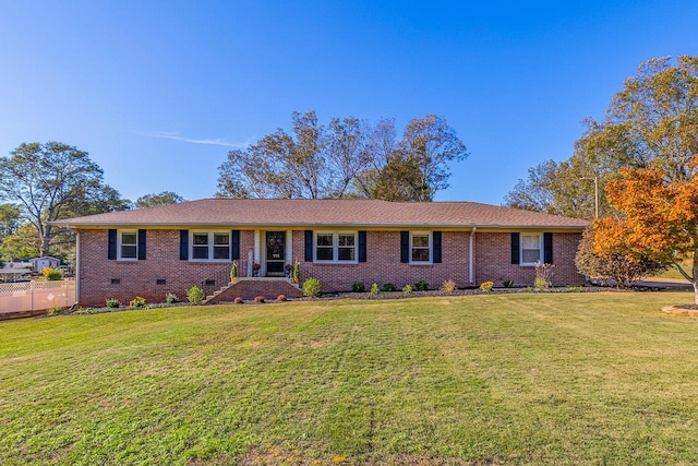 ranch-style home with a front yard