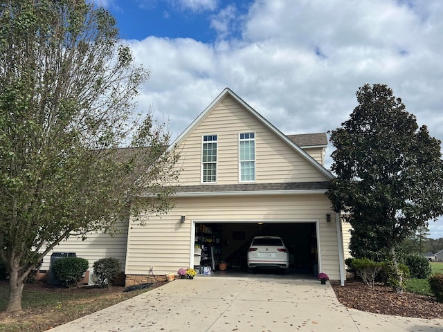 view of side of home with a garage