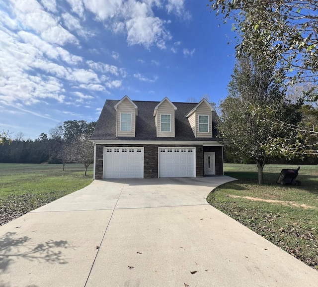 view of front of home featuring a front lawn and a garage