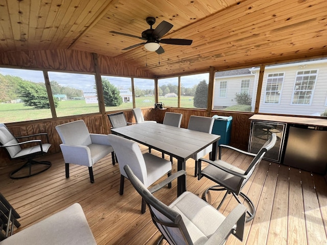 sunroom / solarium with wine cooler, lofted ceiling, wooden ceiling, and ceiling fan