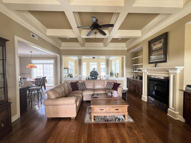 living room with ornamental molding, coffered ceiling, and dark hardwood / wood-style floors