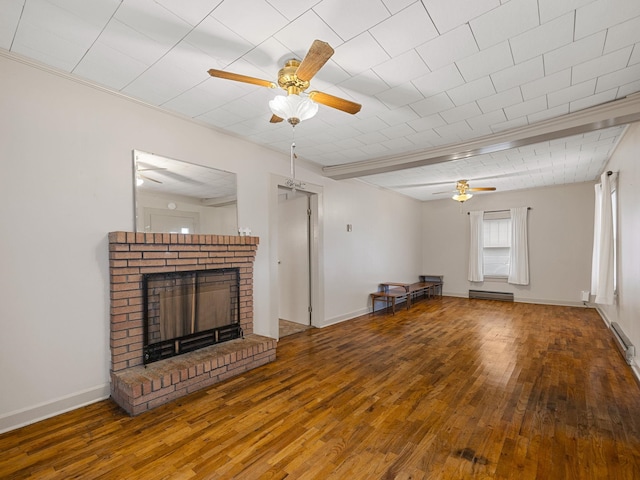 unfurnished living room featuring a brick fireplace, wood-type flooring, and ceiling fan