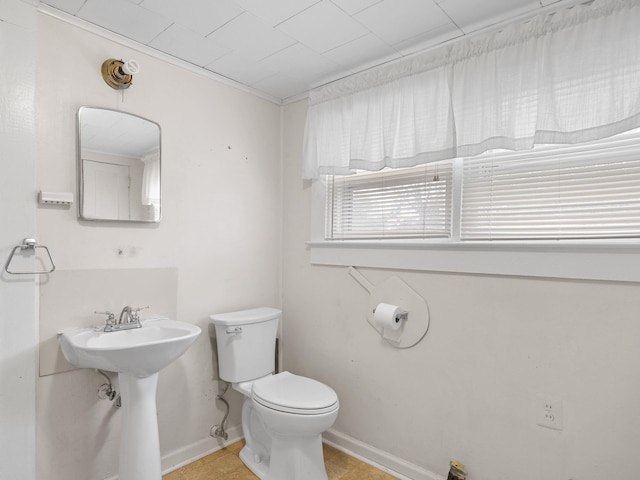 bathroom with tile patterned floors, toilet, and sink