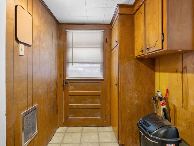 doorway featuring wood walls