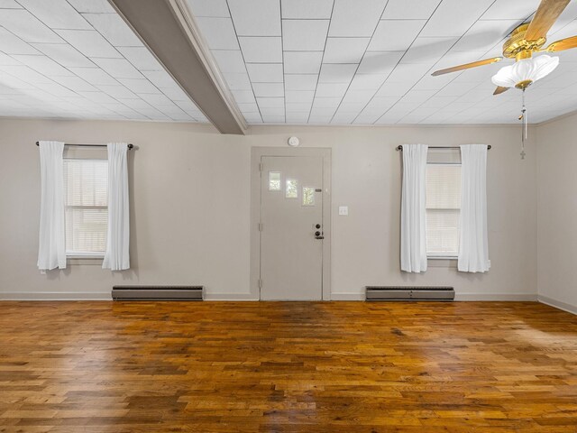 foyer entrance featuring a baseboard radiator, hardwood / wood-style flooring, and ceiling fan