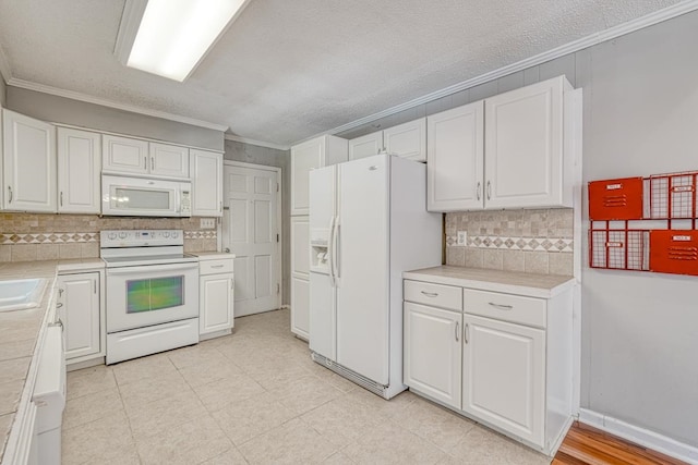 kitchen with white cabinetry, white appliances, backsplash, and crown molding