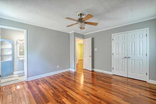 9 Brookdale Acres, Lyman, SC 29365 - unfurnished bedroom featuring hardwood / wood-style flooring, crown molding, a textured ceiling, a closet, and ceiling fan