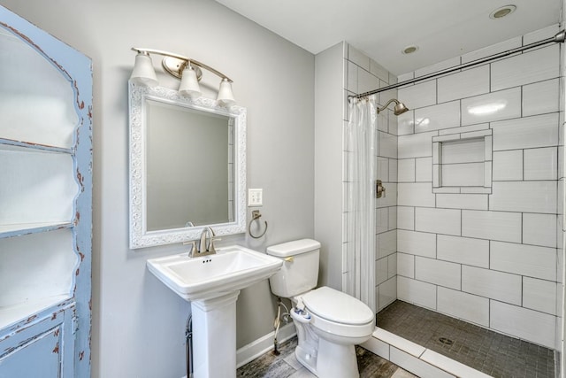 bathroom with toilet, a shower with shower curtain, and hardwood / wood-style flooring