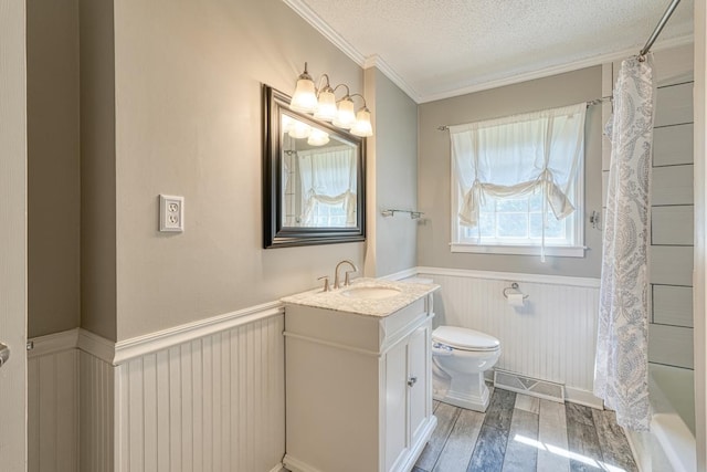 9 Brookdale Acres, Lyman, SC 29365 - full bath featuring wainscoting, ornamental molding, vanity, a textured ceiling, and toilet