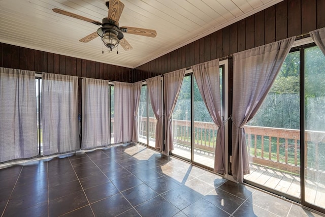 unfurnished sunroom with wooden ceiling and ceiling fan