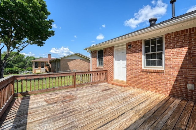 deck featuring a lawn