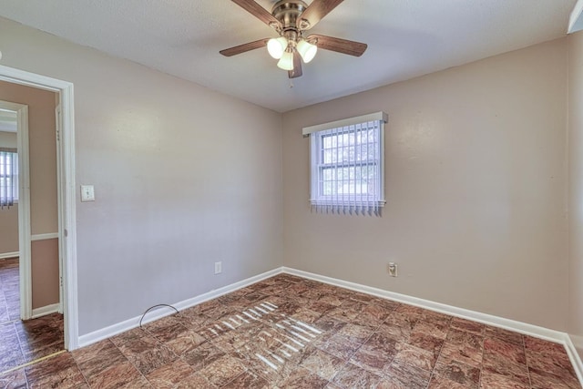 unfurnished room with ceiling fan