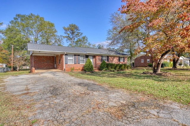 single story home with a carport and a front yard