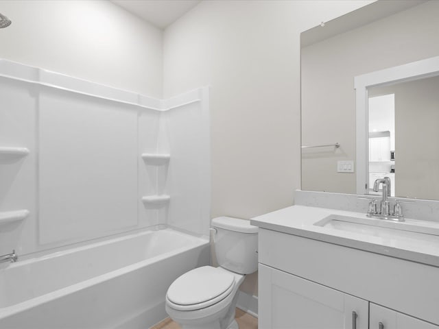 full bathroom featuring vanity, bathtub / shower combination, and toilet