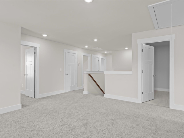 unfurnished room featuring light carpet