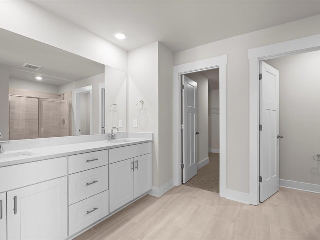 bathroom with vanity and walk in shower