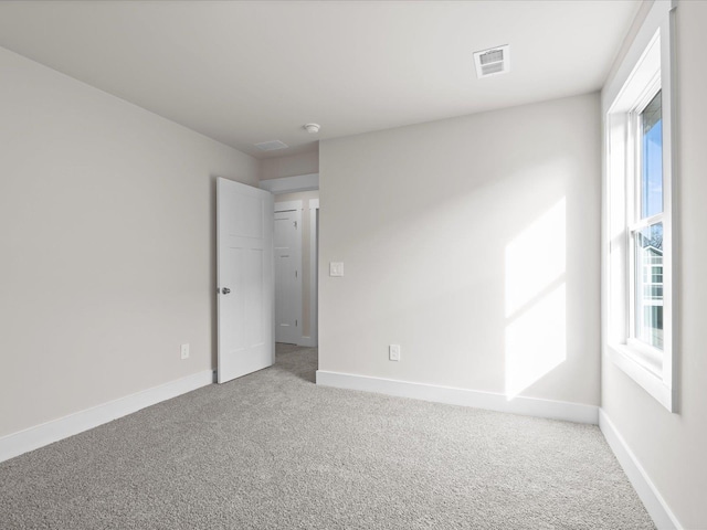 spare room featuring carpet floors