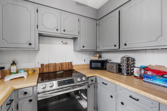 kitchen featuring stainless steel range with electric stovetop