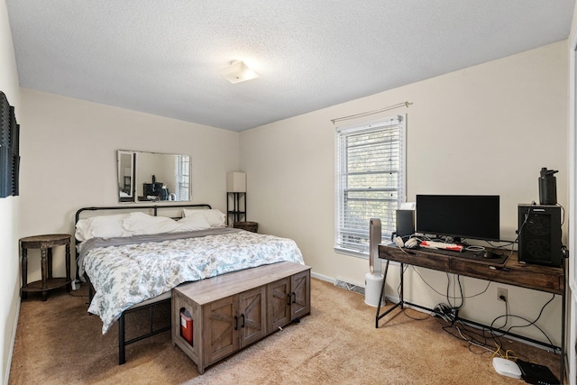 carpeted bedroom featuring a textured ceiling