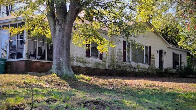 view of home's exterior featuring a sunroom