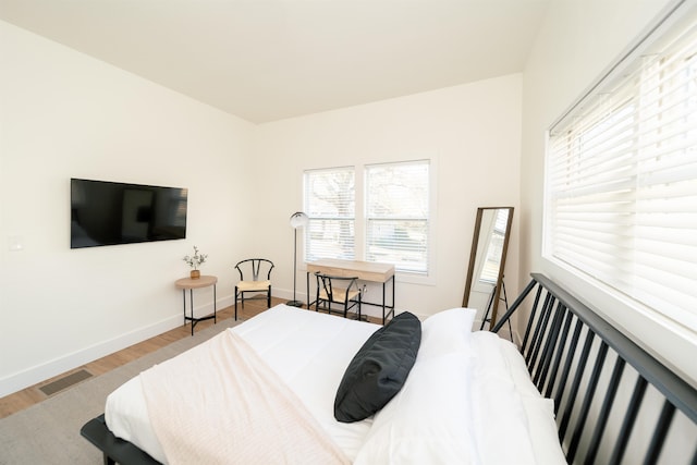 bedroom with light hardwood / wood-style flooring