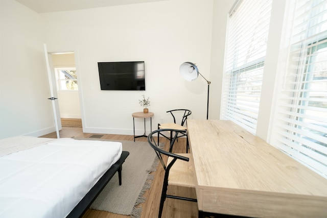 bedroom with light hardwood / wood-style flooring