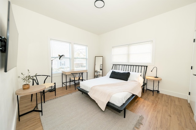 bedroom with light hardwood / wood-style floors