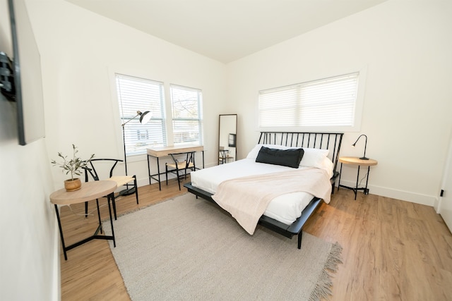 bedroom with light hardwood / wood-style floors